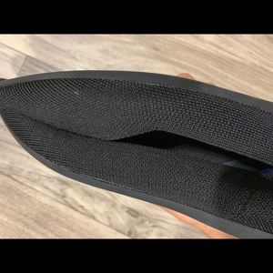 Rothy’s black pointed toe flats.